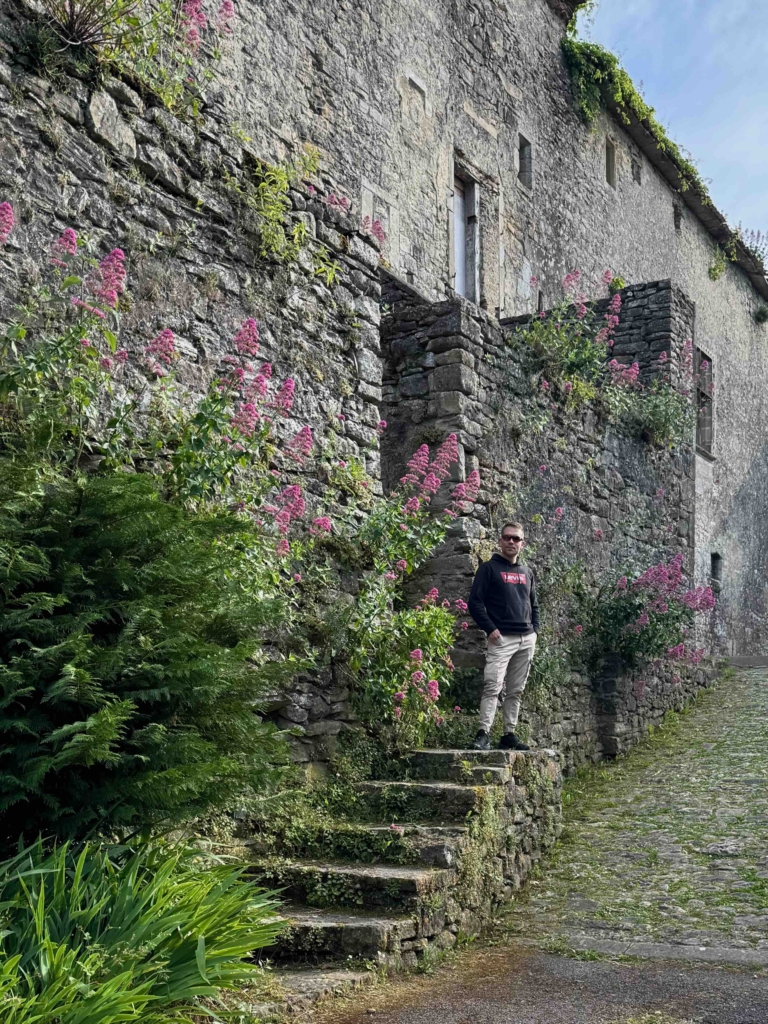 Camon France, Marc LaPierre in village on stair with old village wall in behind